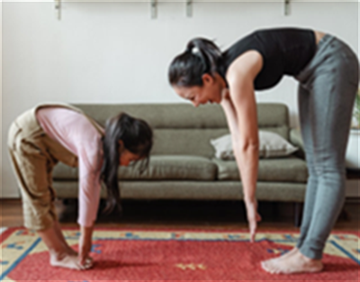 Woman Exercising with Daughter